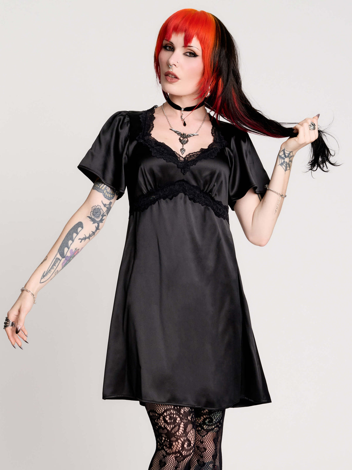 black satin short-sleeve dress with lace trim