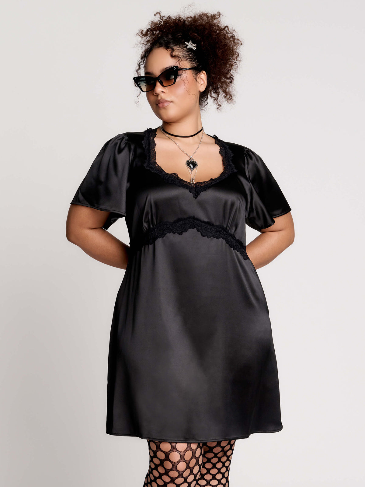 black satin short-sleeve dress with lace trim