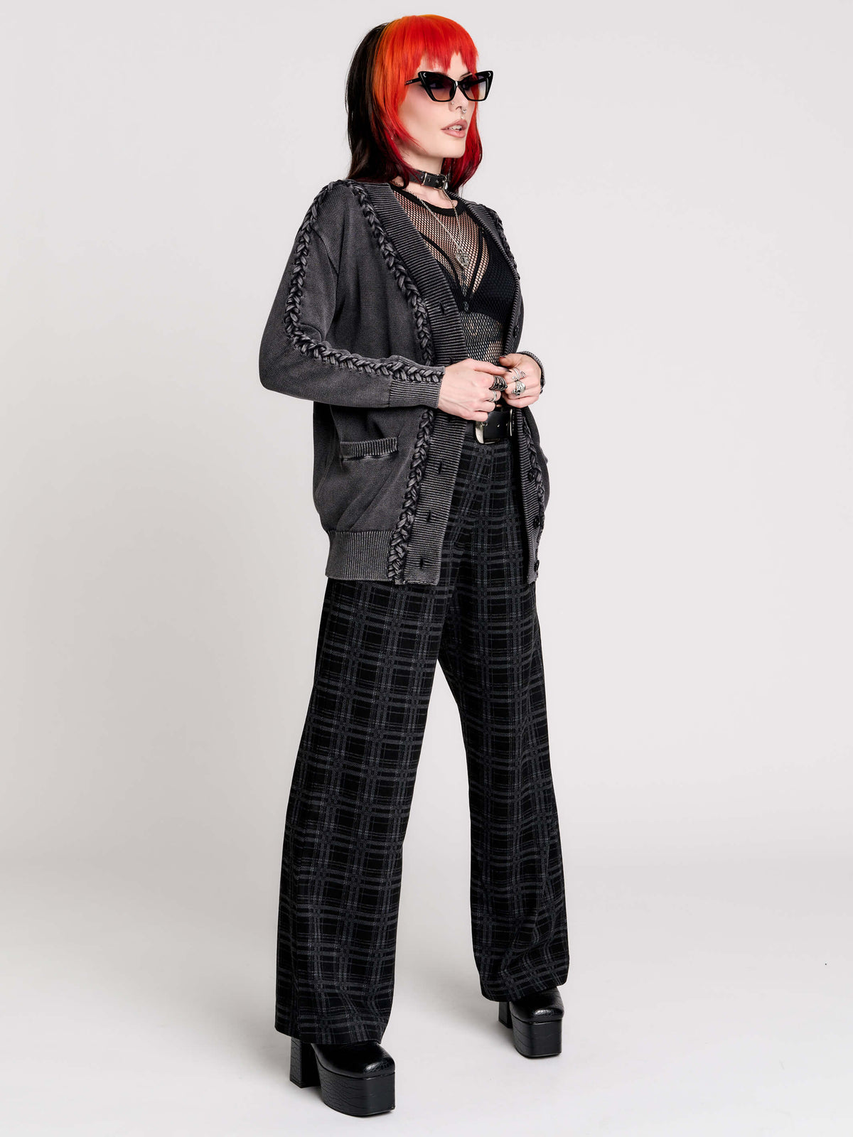 a dark gray textured cardigan with braided details