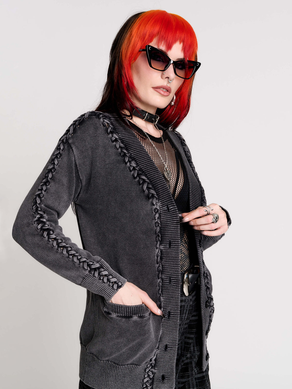 a dark gray textured cardigan with braided details