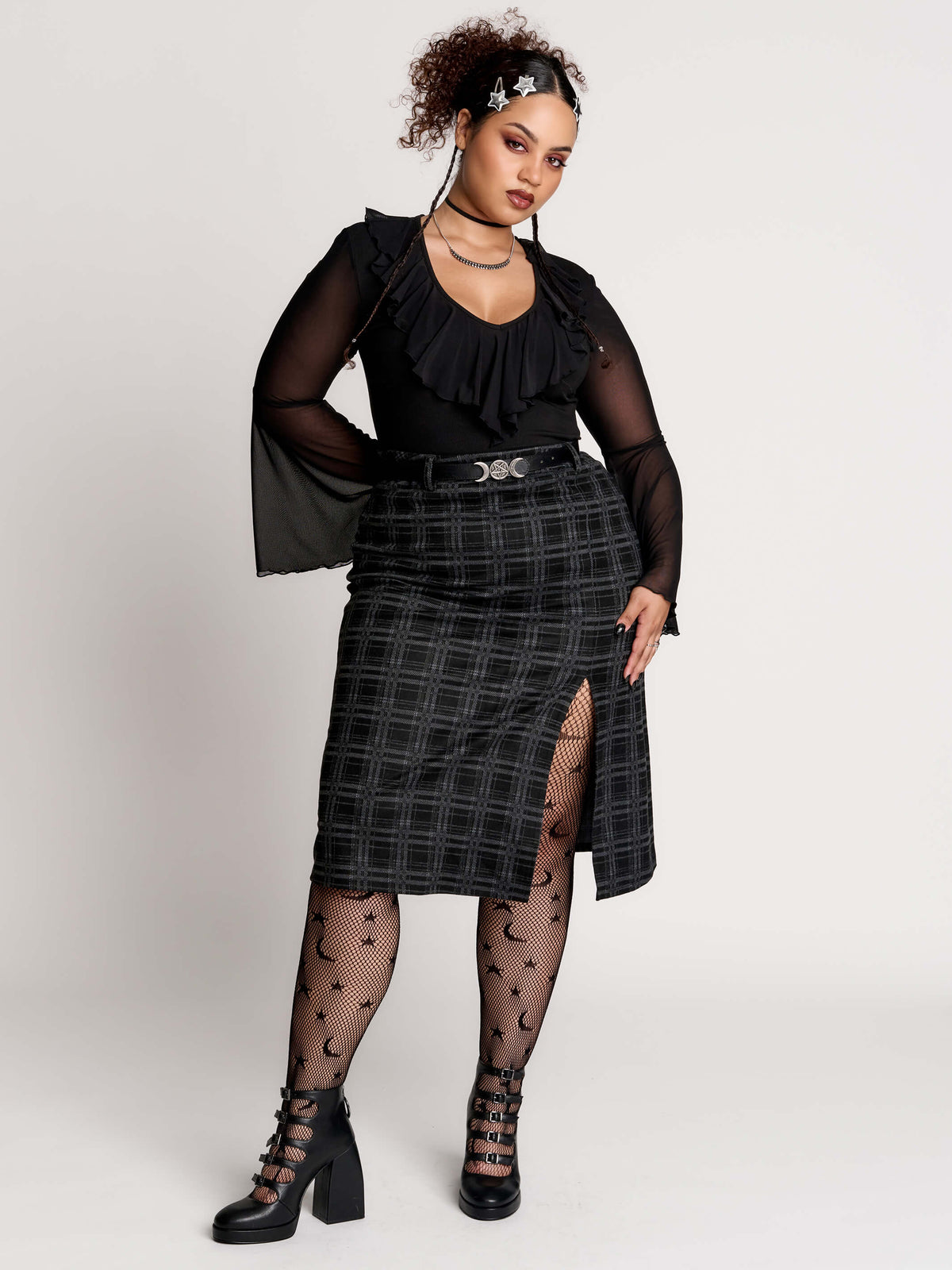 a black and gray plaid midi skirt with a front slit,