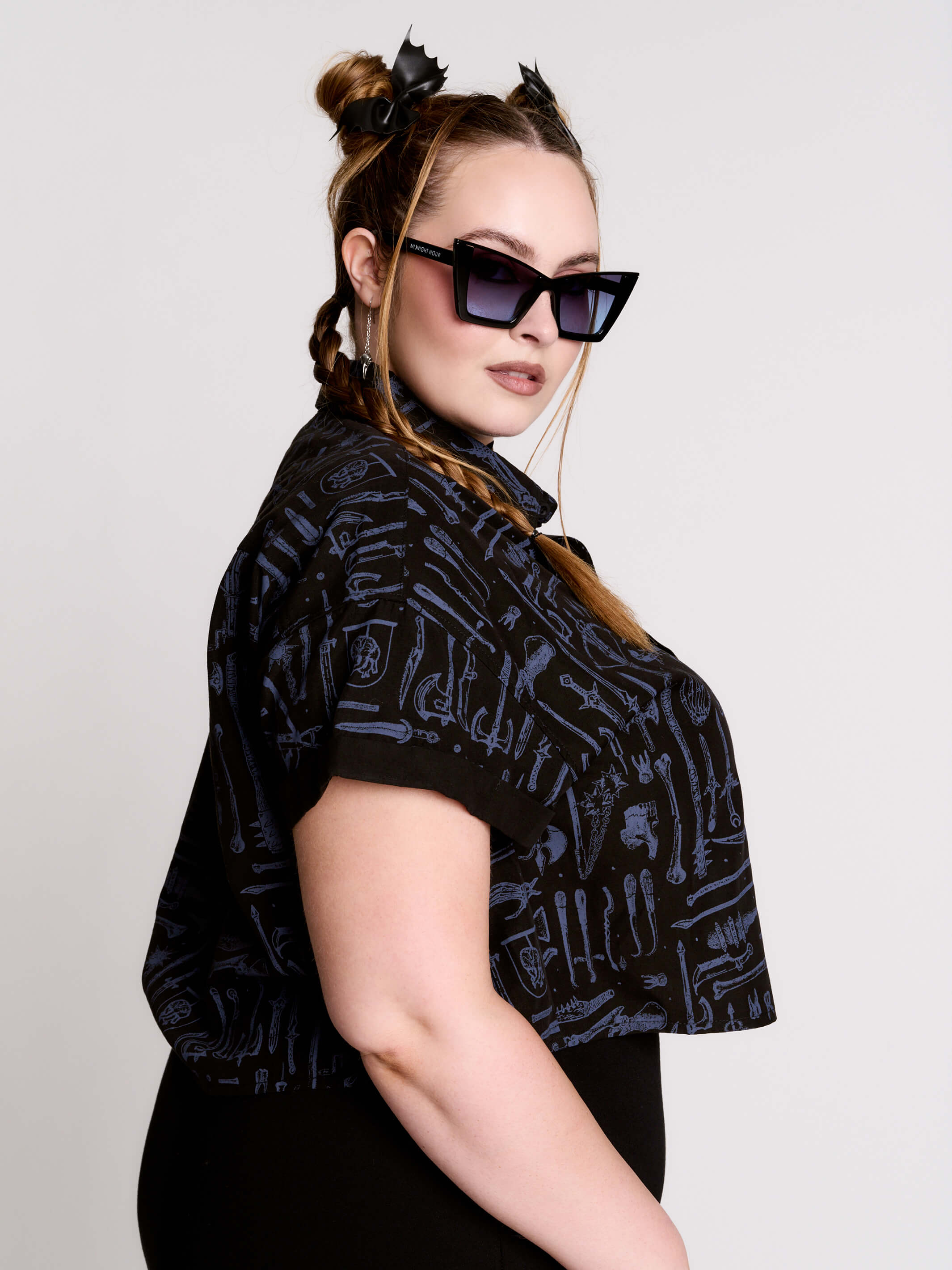 Armory Cropped Shirt is a boxy, cropped, short-sleeve button-down that mixes crisp classic shirting with dark, gothic illustration.