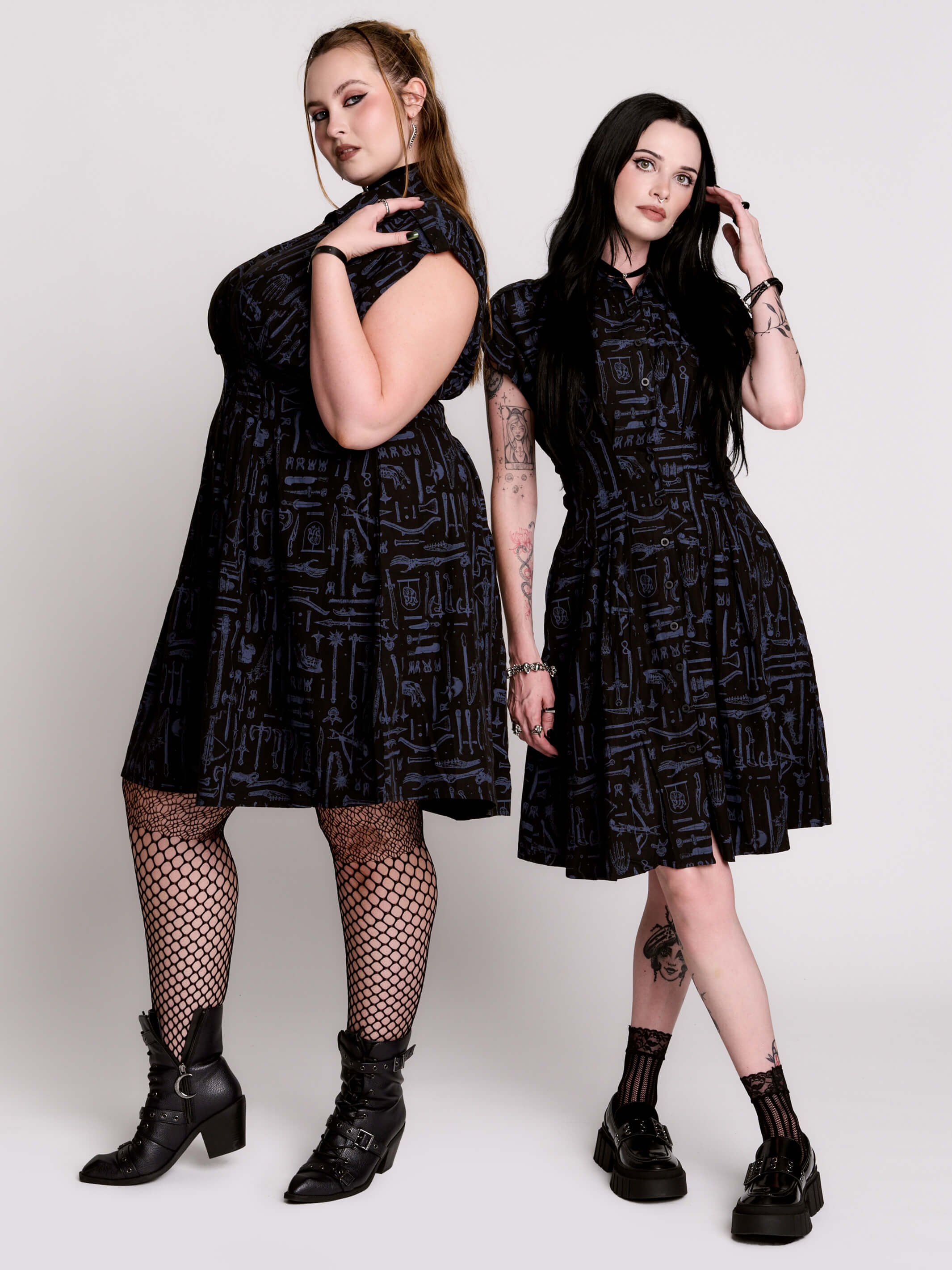 a button-front shirt dress featuring a striking medieval-inspired print with weaponry and macabre motifs.
