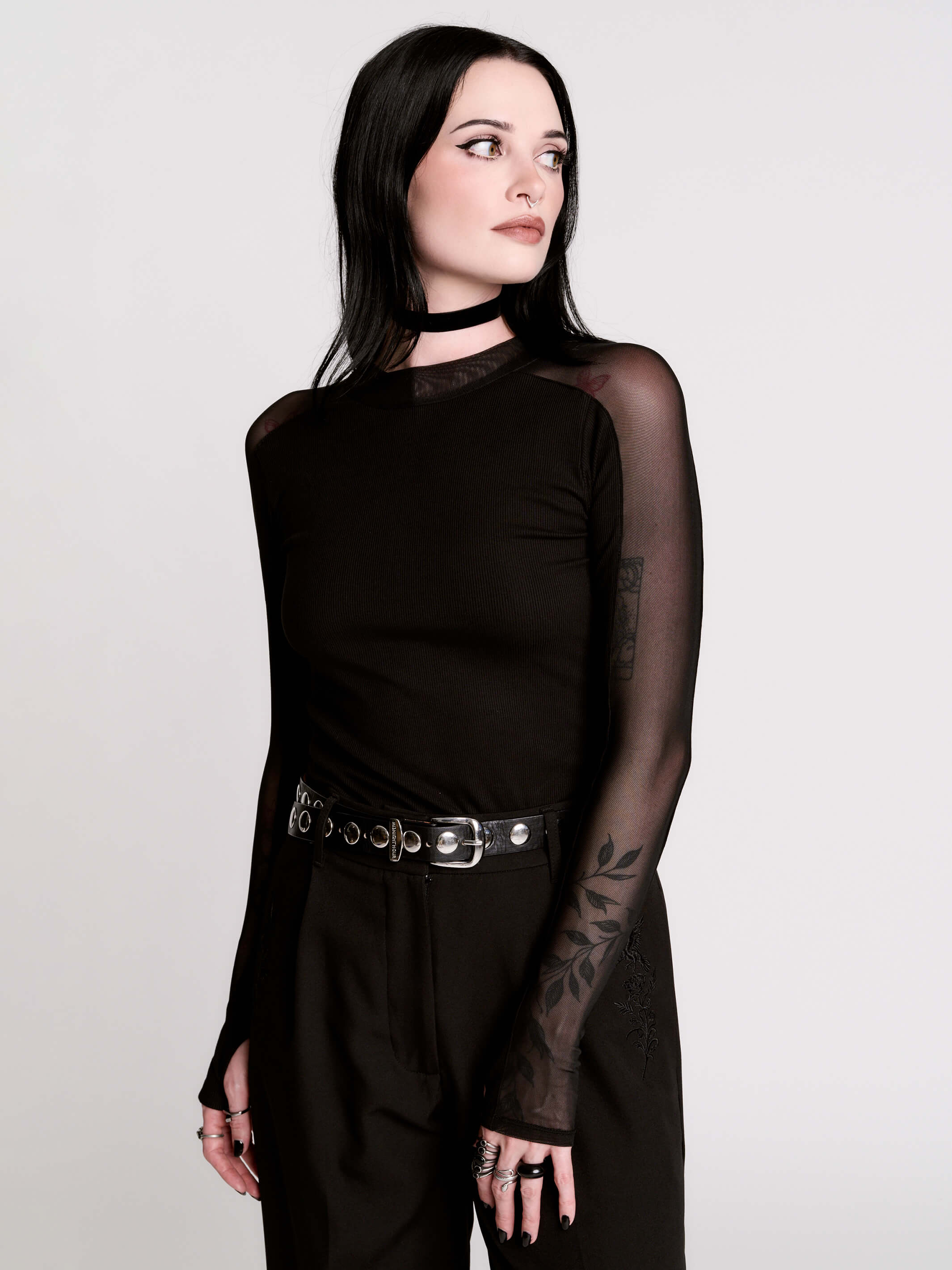 black long-sleeve top with sheer mesh sleeves