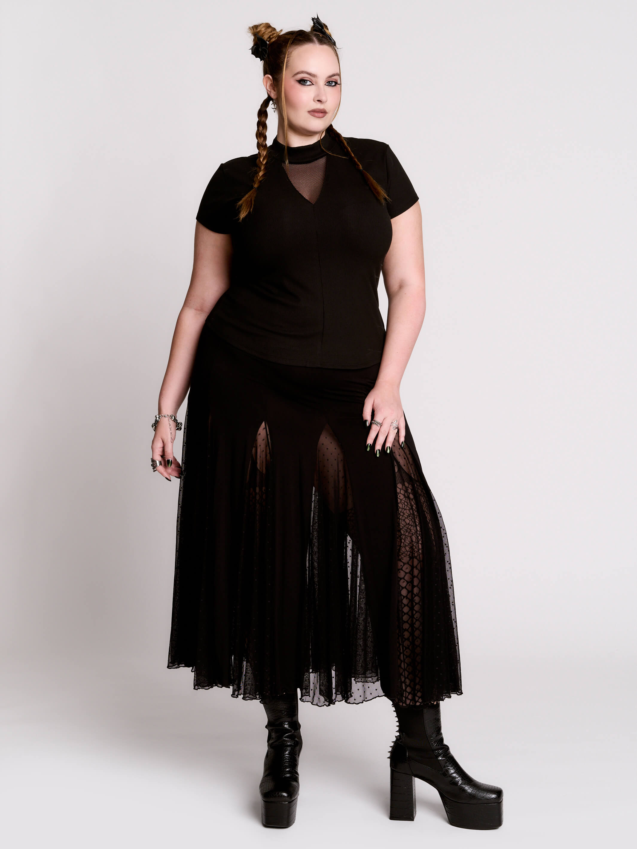 A black short-sleeve mock neck top with a fishnet mesh chest panel.