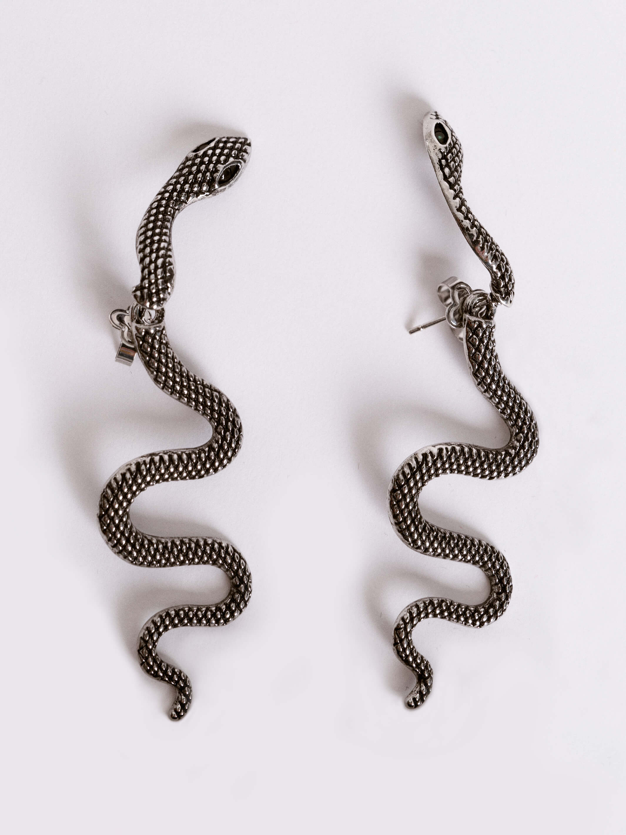 Pierced snake earring