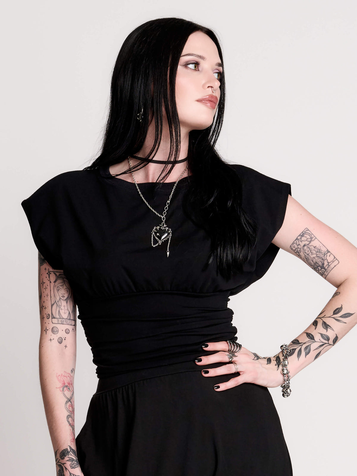 short sleeve top with a softly draped silhouette and a flattering, cinched waist.
