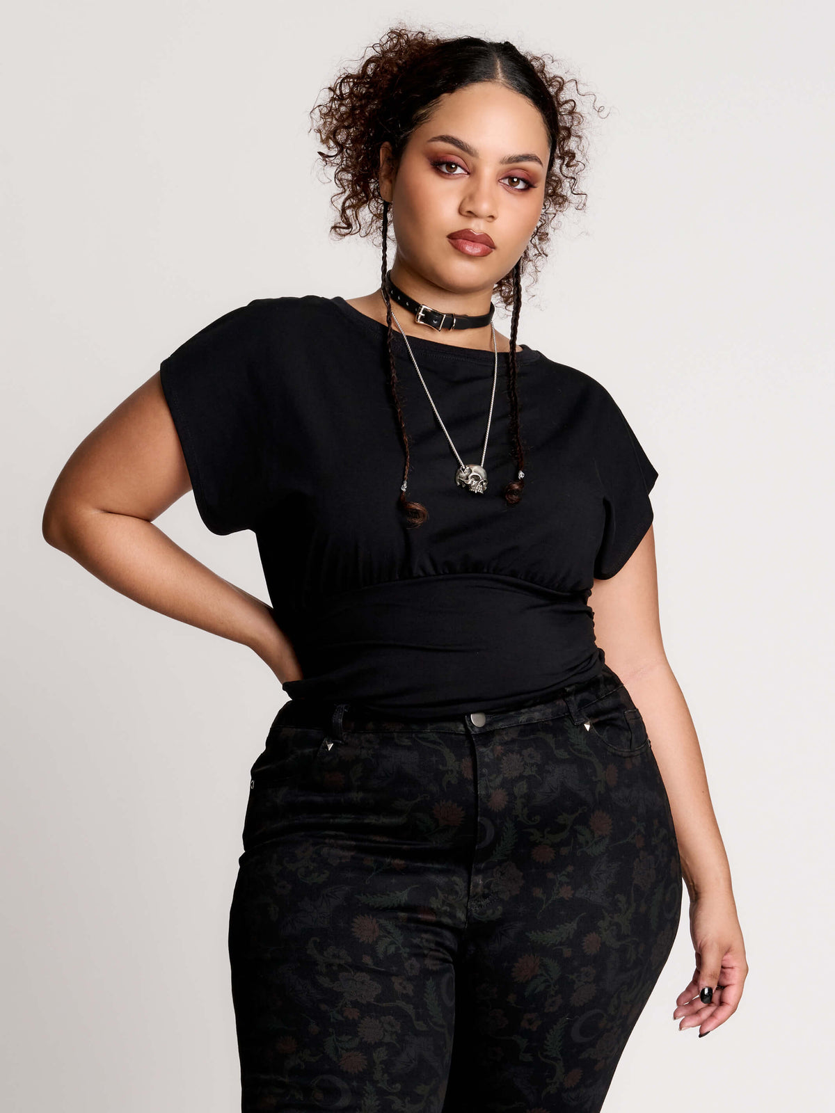 short sleeve top with a softly draped silhouette and a flattering, cinched waist.