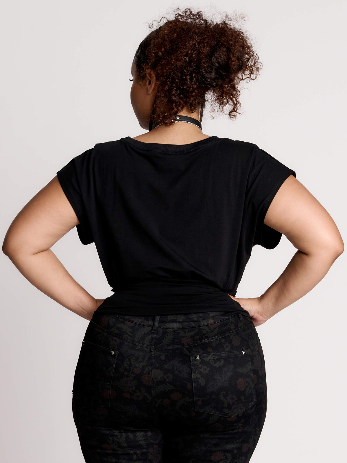 short sleeve top with a softly draped silhouette and a flattering, cinched waist.