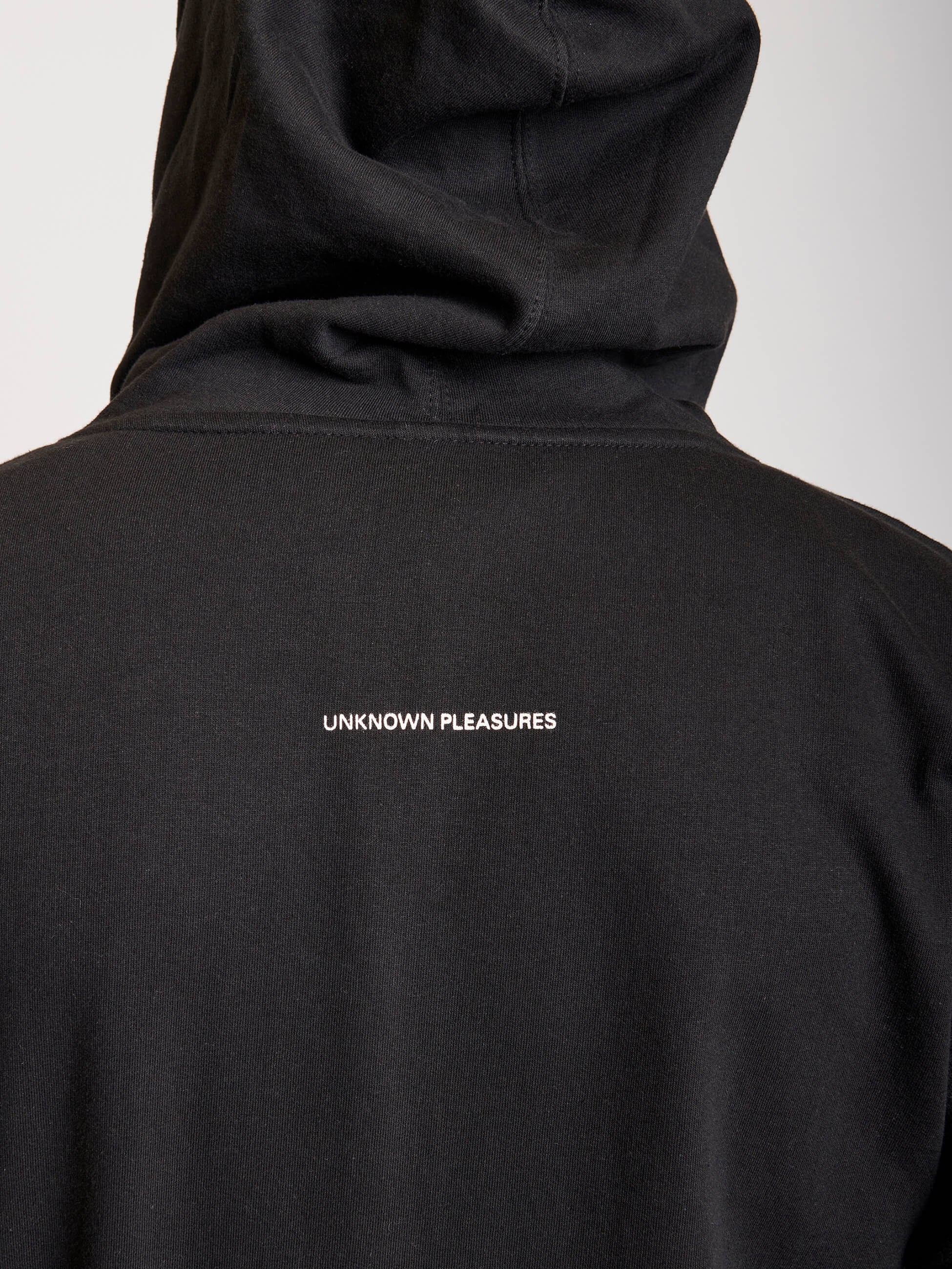 black zip hoodie with white graphics on front
