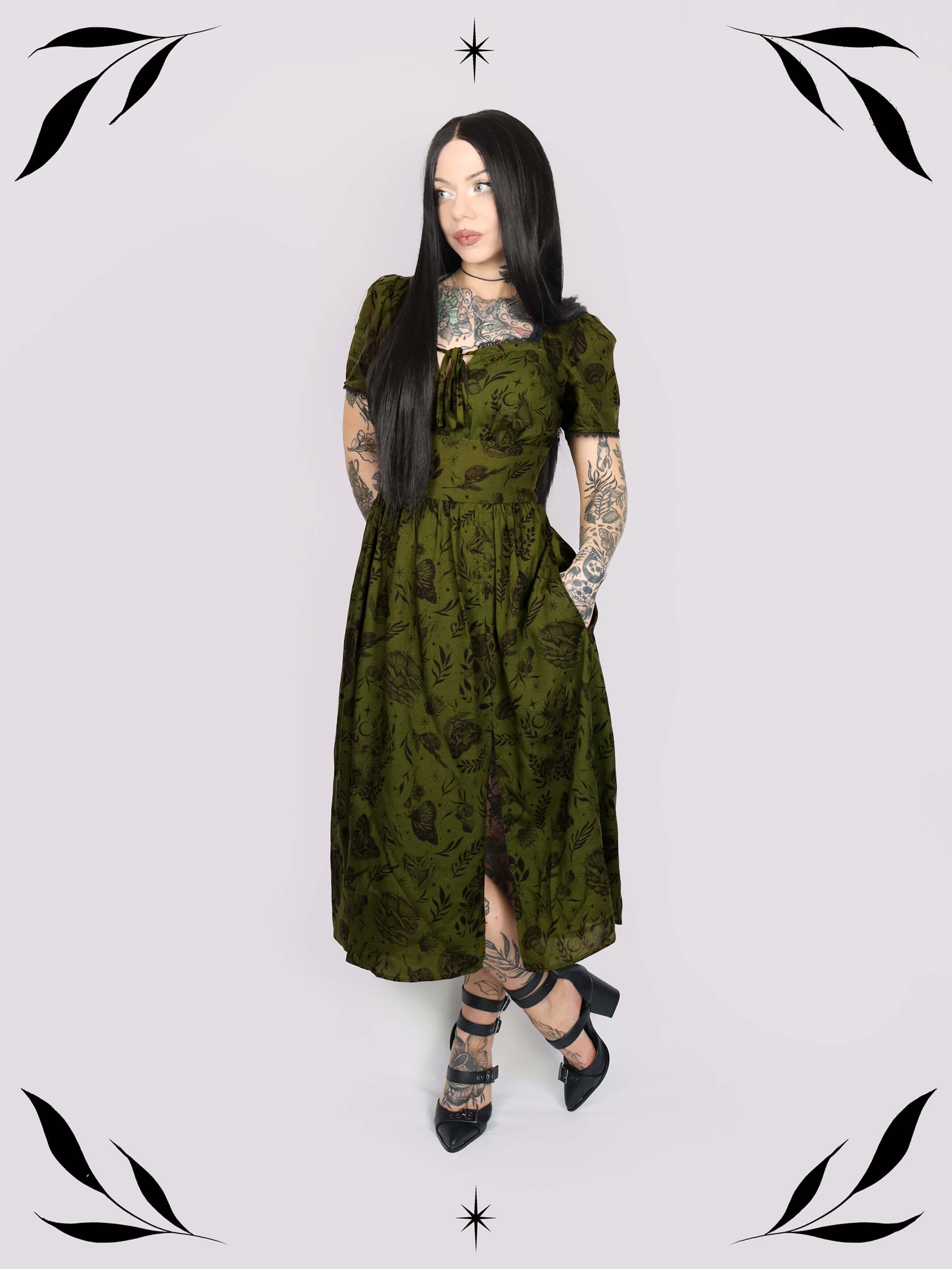 a short-sleeved olive green midi dress with a gothic pattern