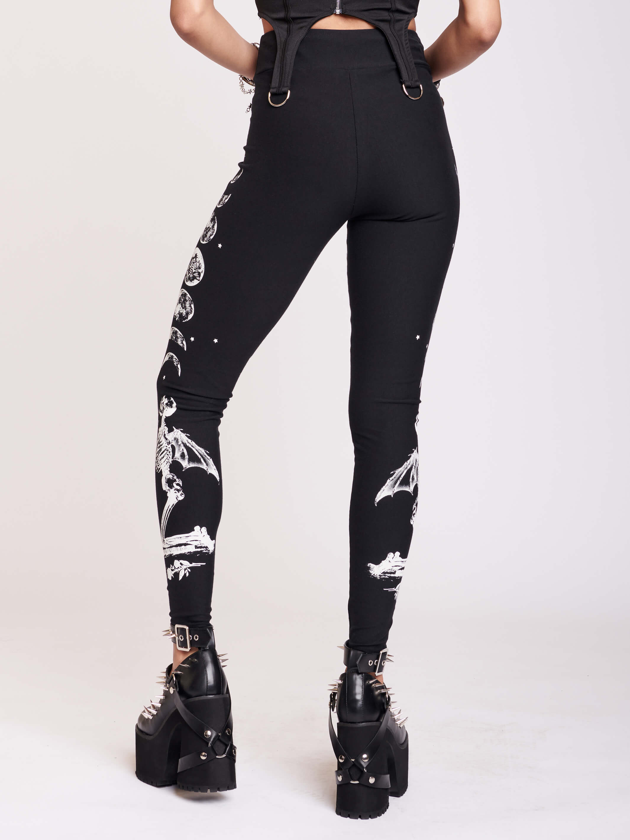 BLACK LEGGING WITH WHITE GRAPHIC FEATURING PRAYING SKELTONAND MOON PHASE