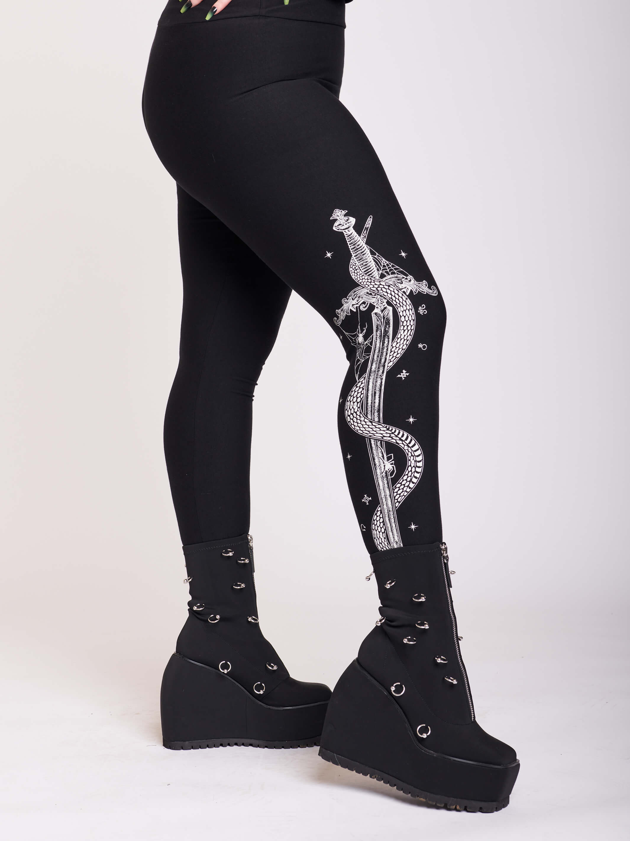 black legging with snake and dagger graphic on side