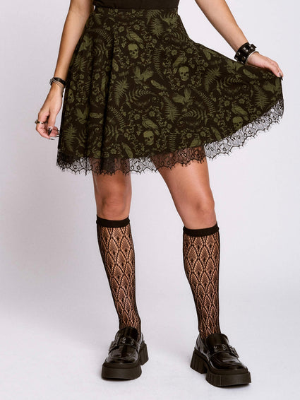 a woman wearing a skirt and black socks