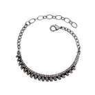 Silver spine inspired bracelet on a white background