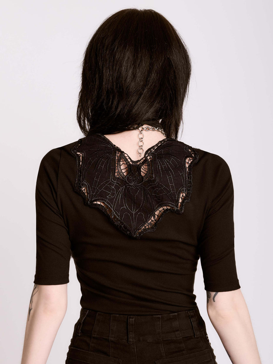 a woman wearing a black dress