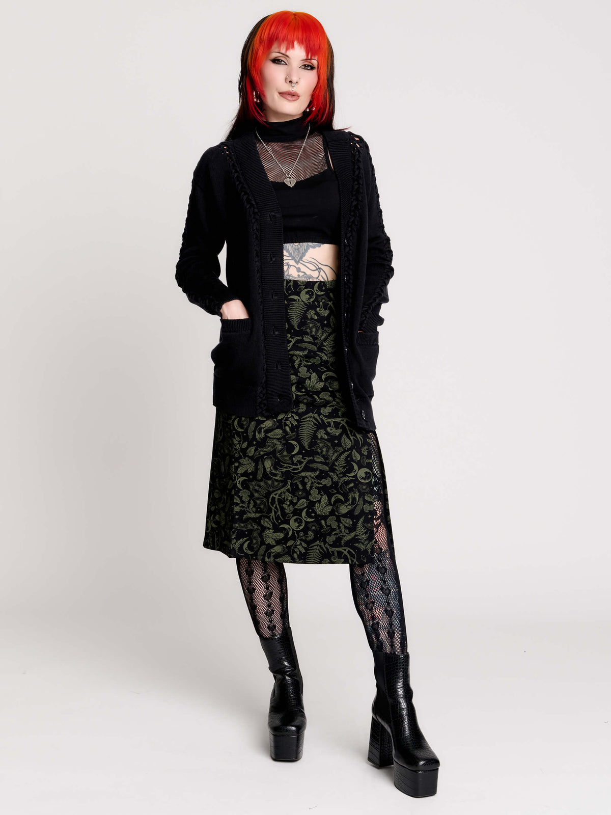 a black knit cardigan with braided details