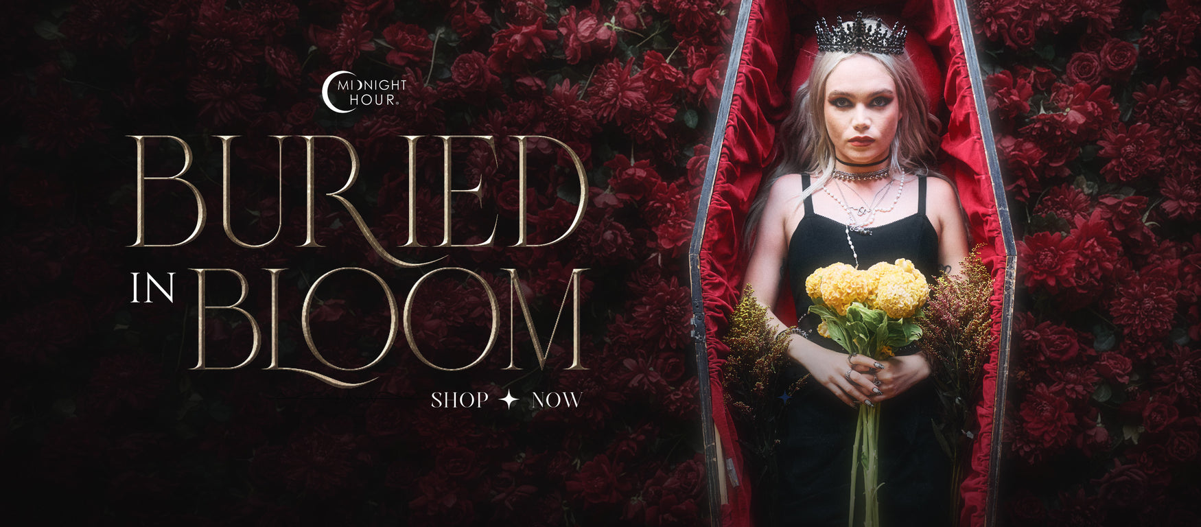 a woman in a black dress holding flowers