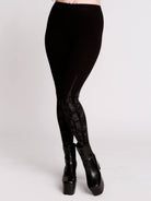Black leggings with a dark gray gothic cathedral line-art print down the legs.