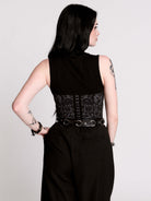 A black sleeveless top with a printed floral lace corset in light grey.