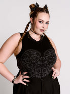 A black sleeveless top with a printed floral lace corset in light grey.