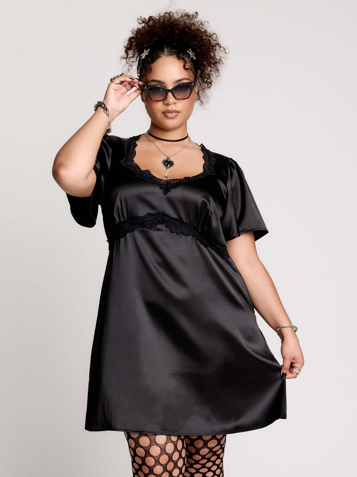 black satin short-sleeve dress with lace trim