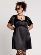 black satin short-sleeve dress with lace trim