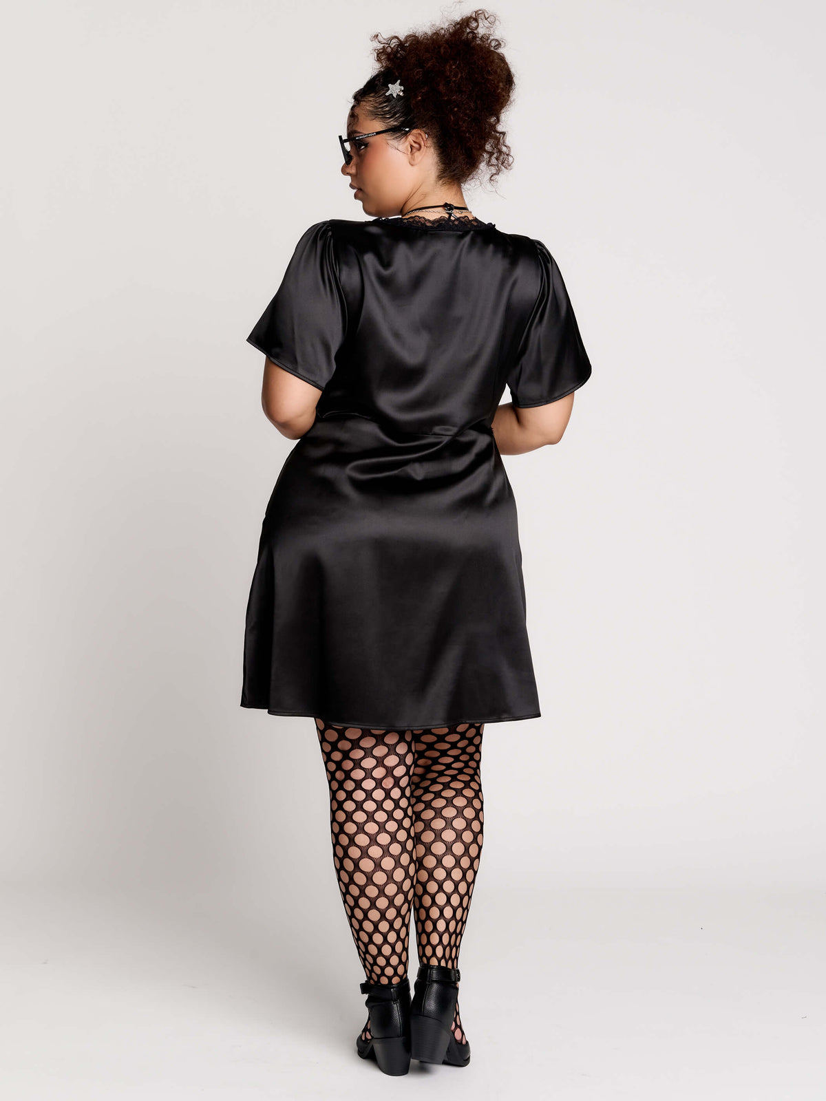 black satin short-sleeve dress with lace trim