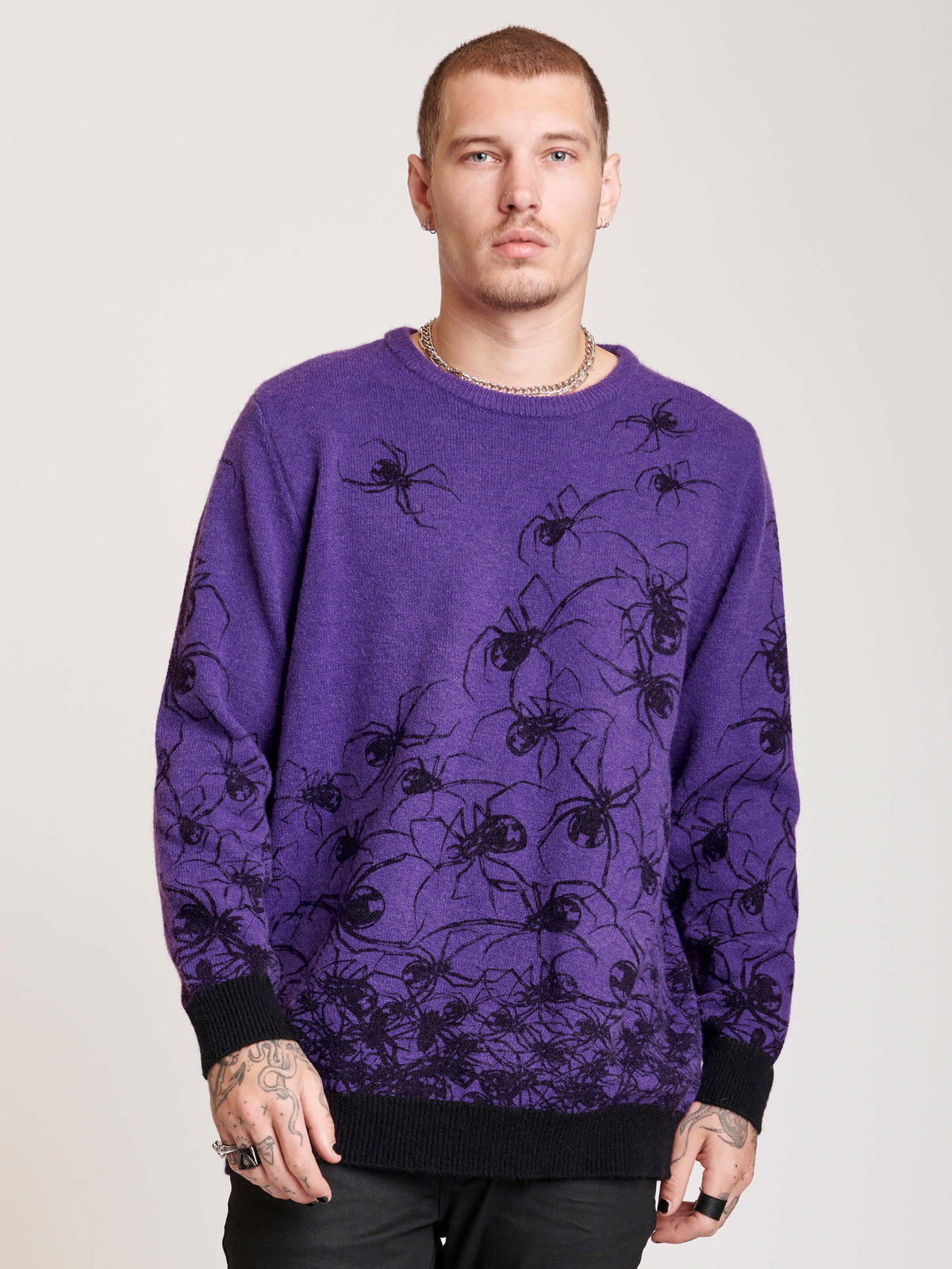  purple sweater with spiders all over