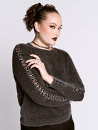 distressed braided sweater