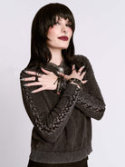 DISTRESSED BRAIDED SWEATER