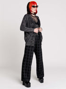 a dark gray textured cardigan with braided details