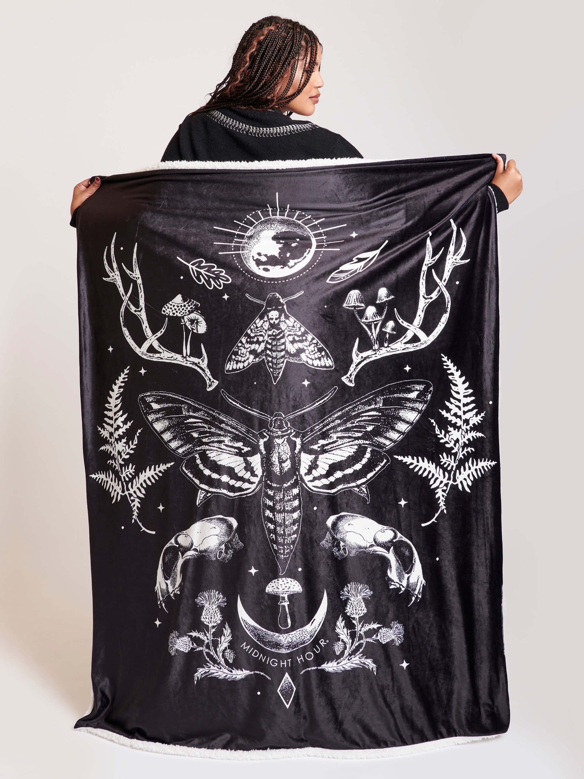 black blanket with white forest findings and deathmoth art