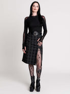 a black and gray plaid midi skirt with a front slit, 