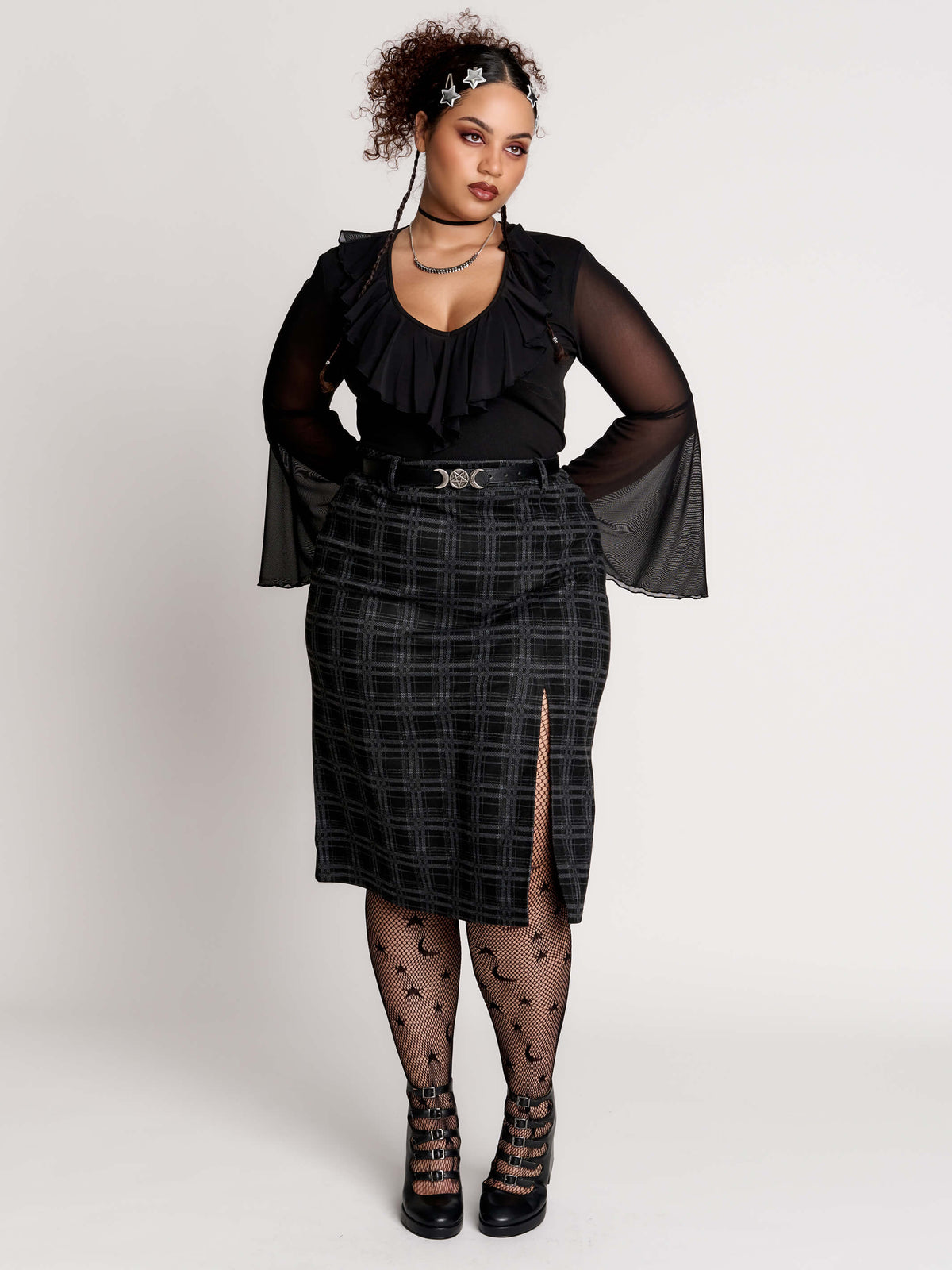  a black and gray plaid midi skirt with a front slit, 