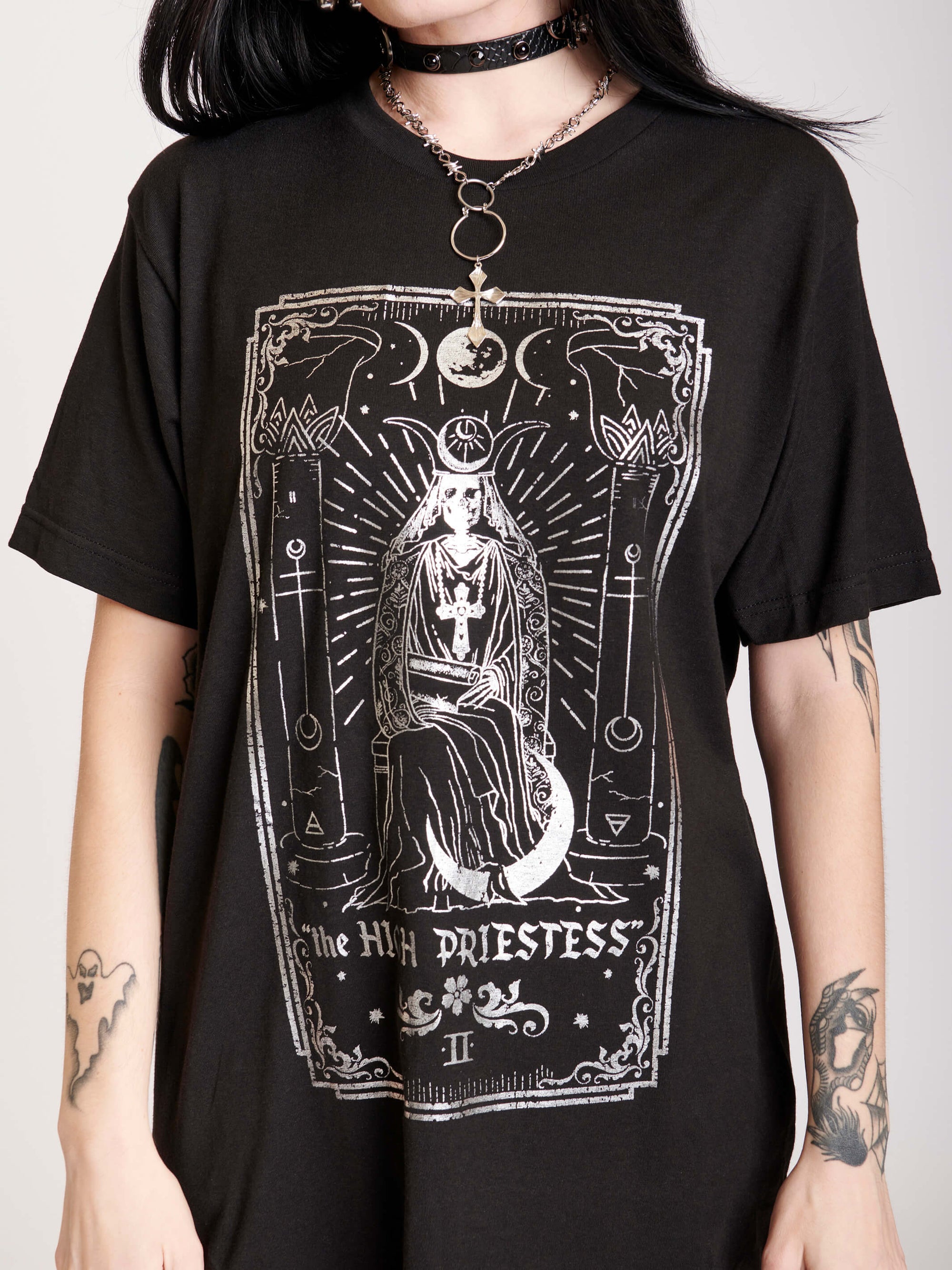 Black t-shirt featuring a sleek silver foil design
