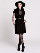 A black short-sleeve dress with a lace V-neckline.