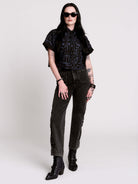 Armory Cropped Shirt is a boxy, cropped, short-sleeve button-down that mixes crisp classic shirting with dark, gothic illustration. 