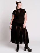 A black short-sleeve mock neck top with a fishnet mesh chest panel.