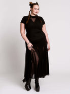 A black short-sleeve mock neck top with a fishnet mesh chest panel.