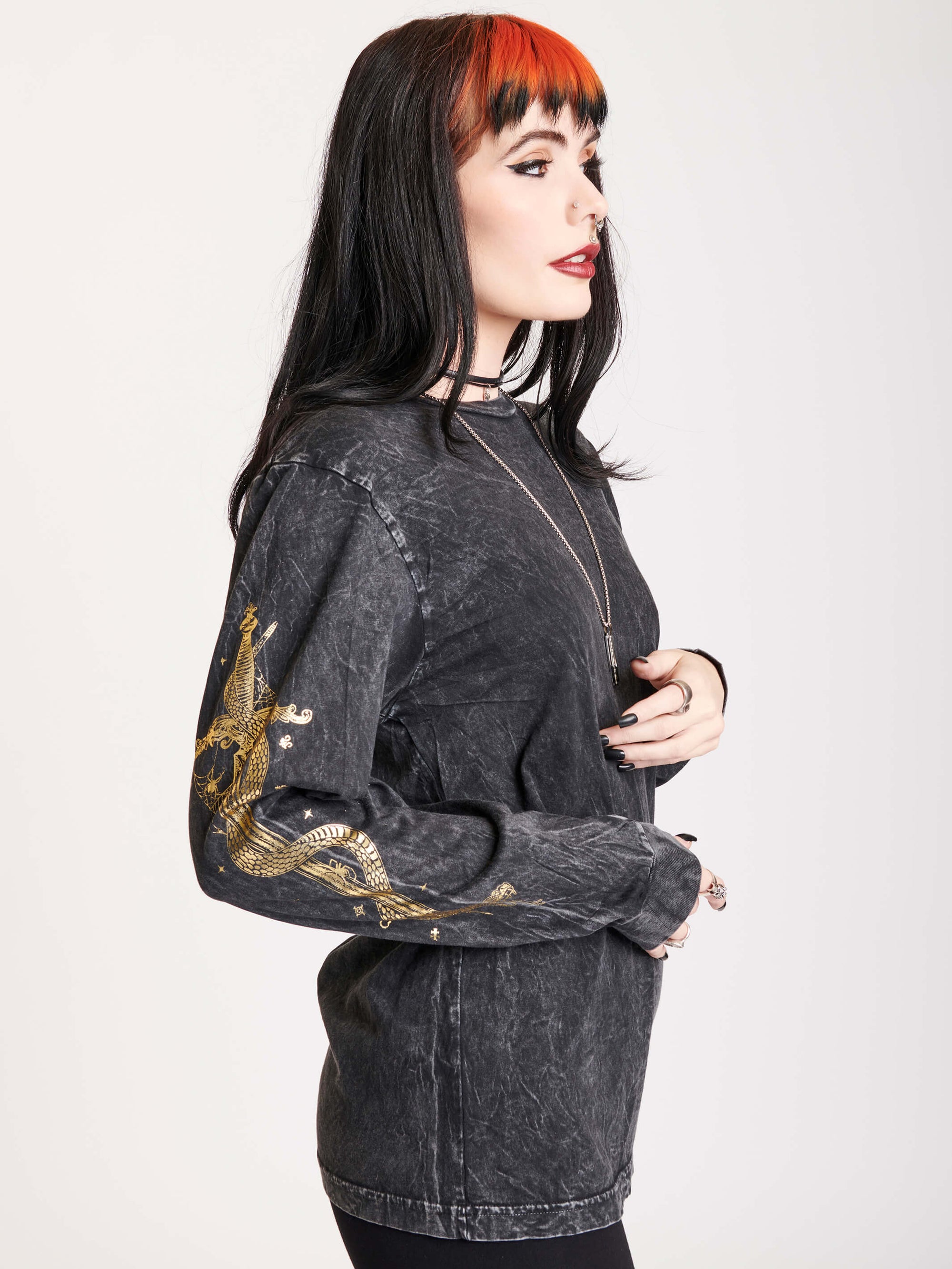 mineral wash long sleeve top with gold dagger and snake on sleeves