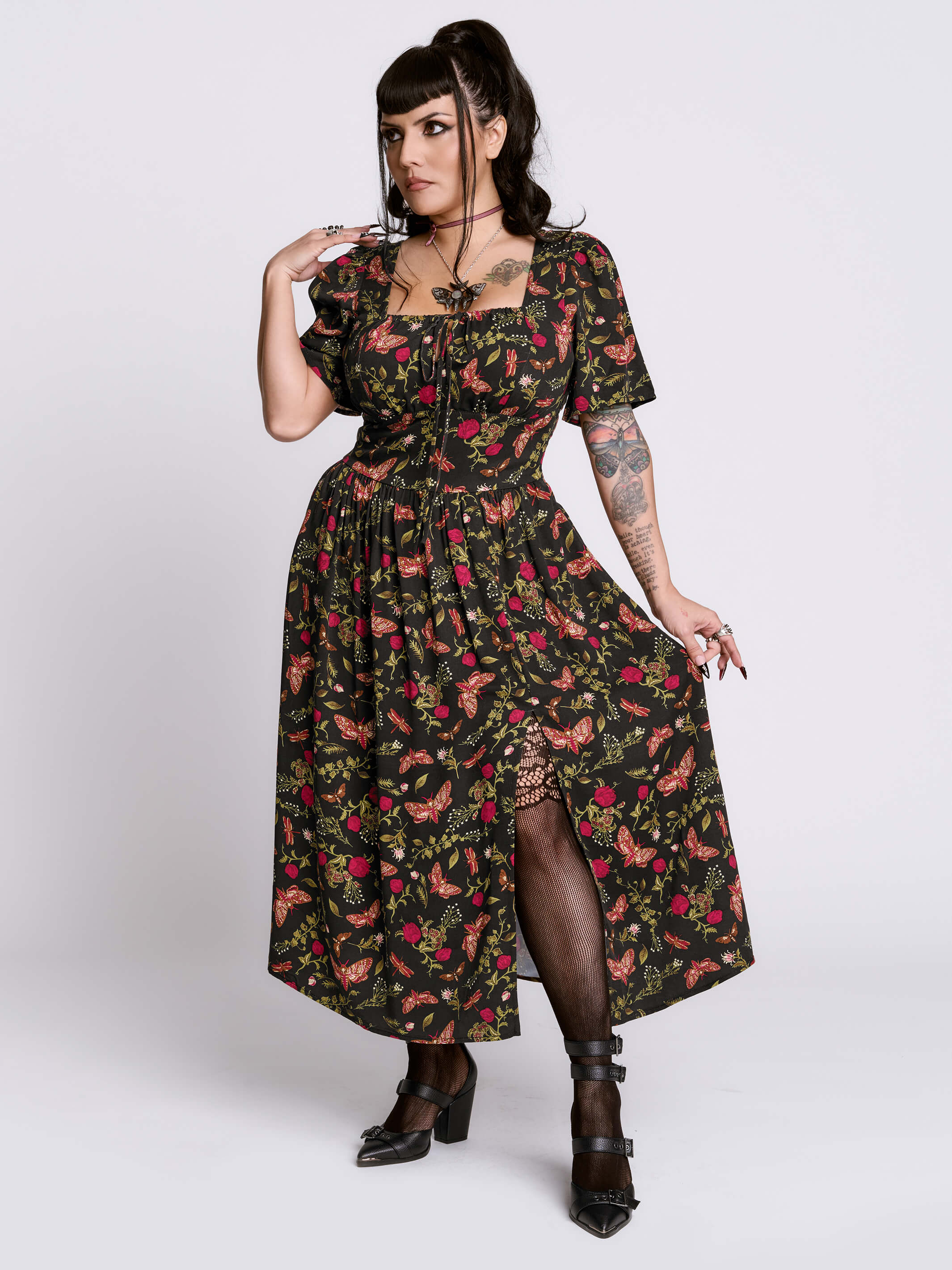 Woman wearing a floral dress with a white background