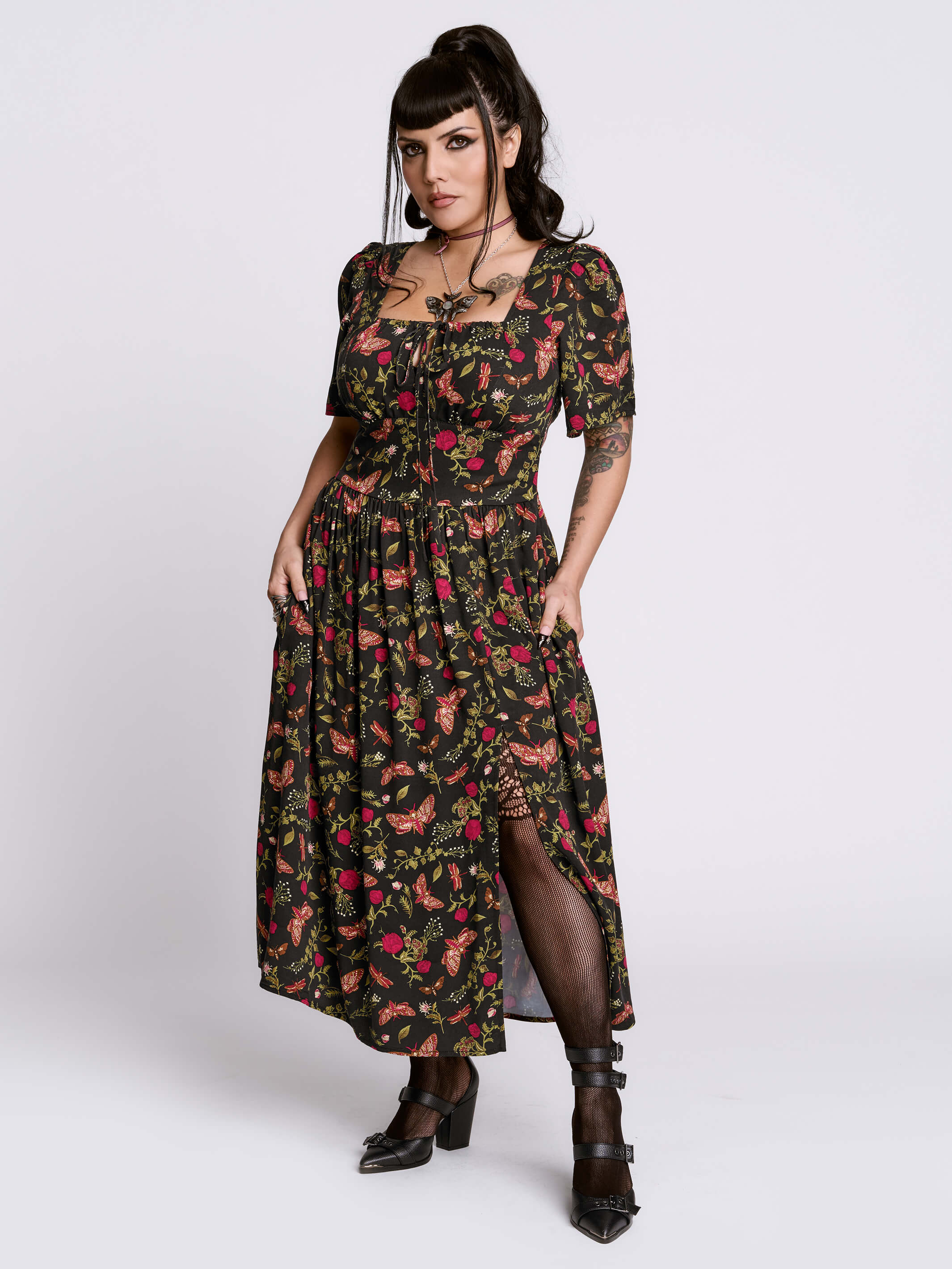 Woman wearing a floral dress with a white background