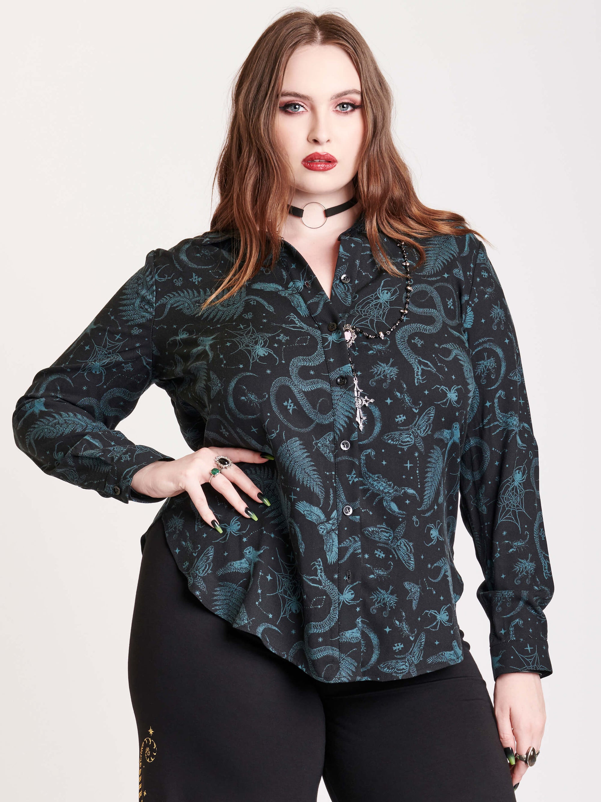 Long sleeve button up top with black and green all over print