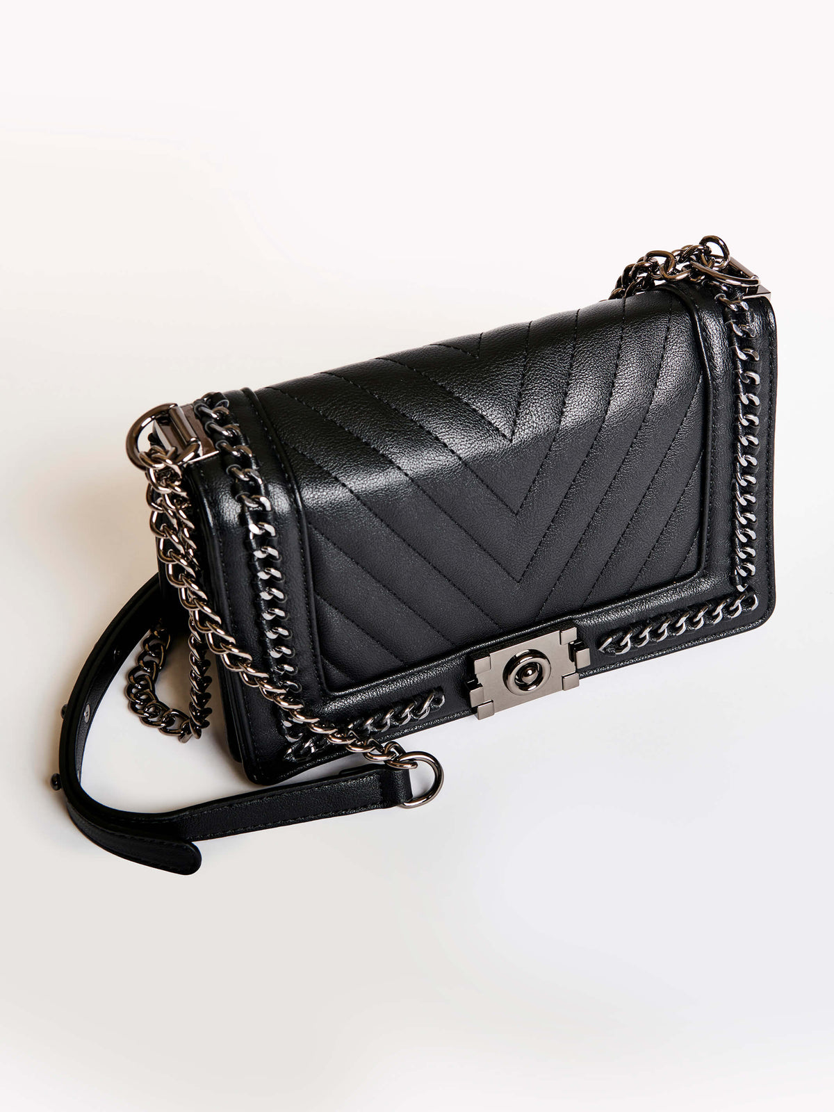 Black quilted purse with silver chain detail