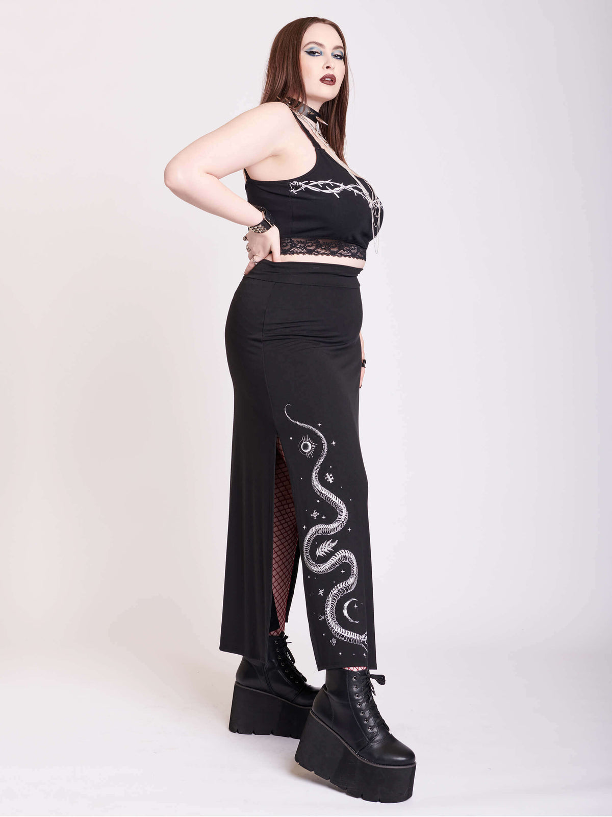 Black skirt with side split and skeleton snake graphic