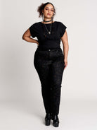  short sleeve top with a softly draped silhouette and a flattering, cinched waist. 