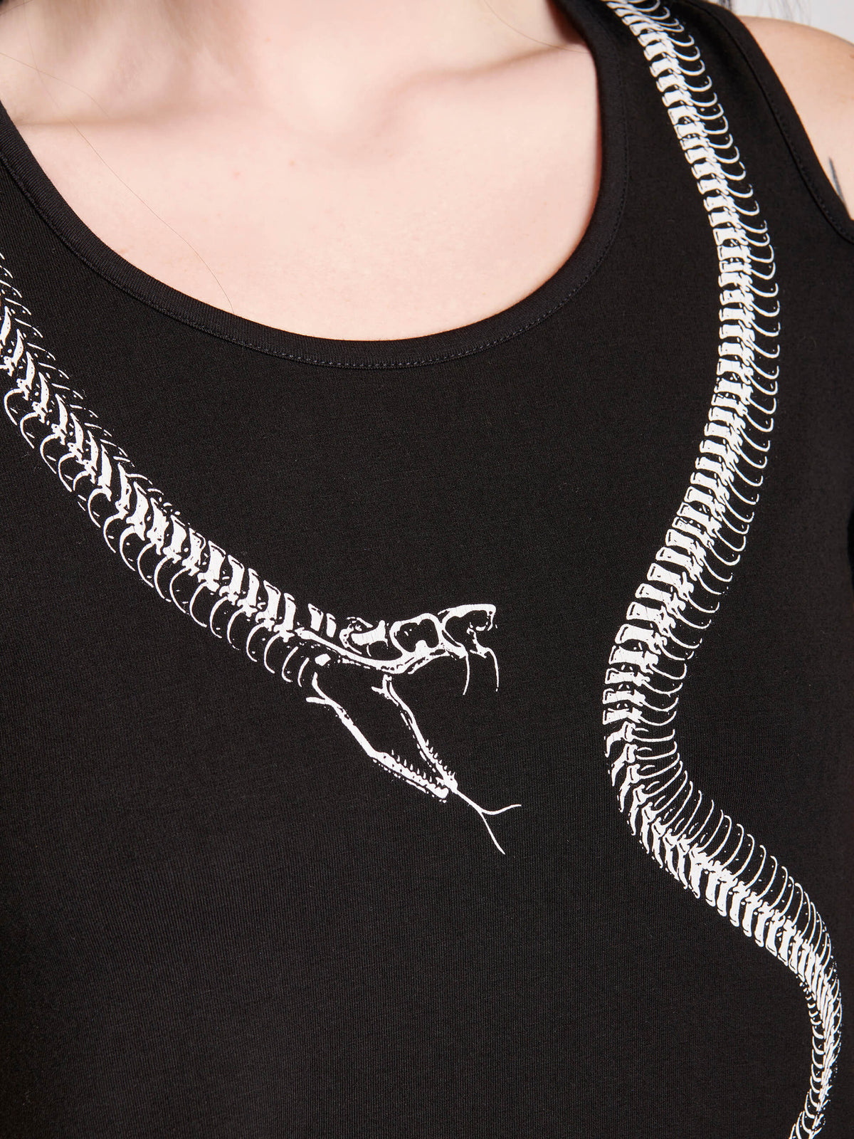 Black dress with skeleton snake art around the neckline