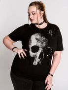 A black t-shirt with a large white skull graphic on the front.