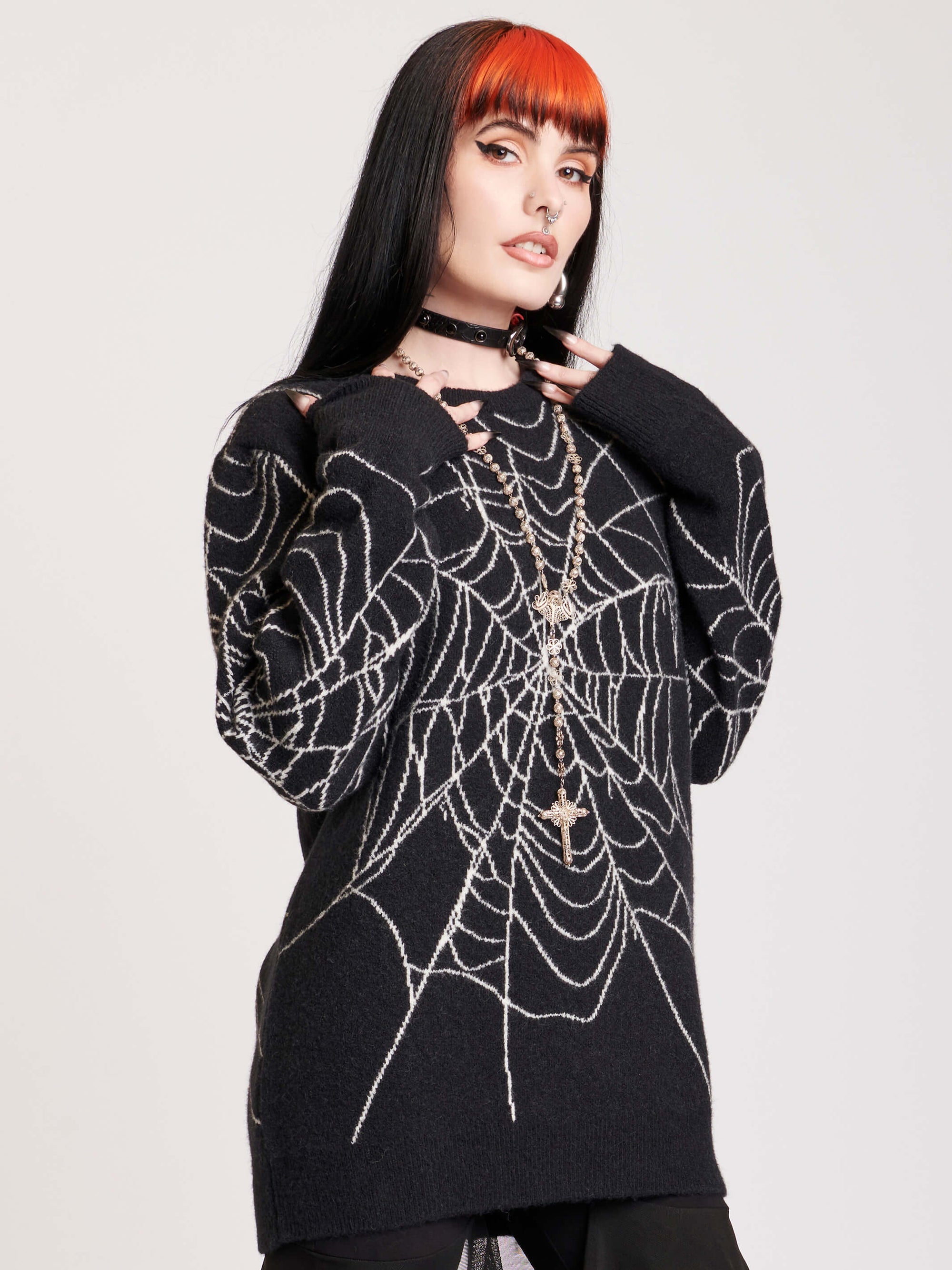 sweater with spiderweb motif on body and sleeves